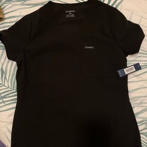 Never been worn, with tags. Semi fitted black scrub top.